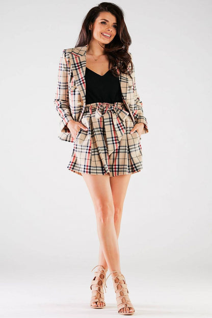 Charming model in the Elegant High-Waisted Loose-Fitting Shorts with Tie Waist and Pockets by Awama, showcasing a classic plaid blazer for a luxurious ensemble.