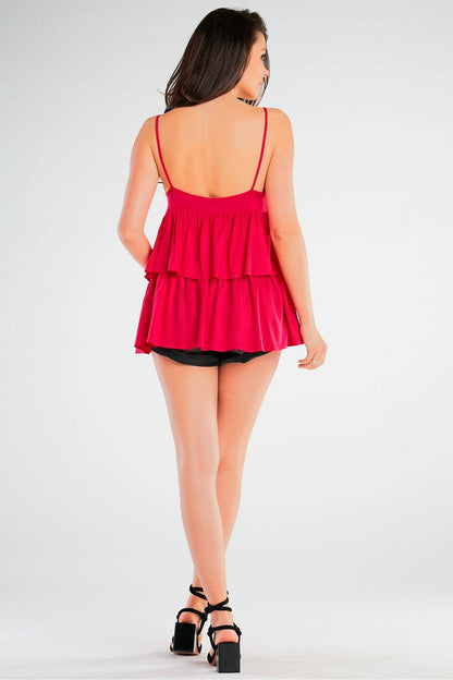 Another angle of a model wearing an elegant loose-fitting viscose blouse with thin straps and frill detailing by Awama, showcasing the stylish and luxurious design tailored for modern elegance.