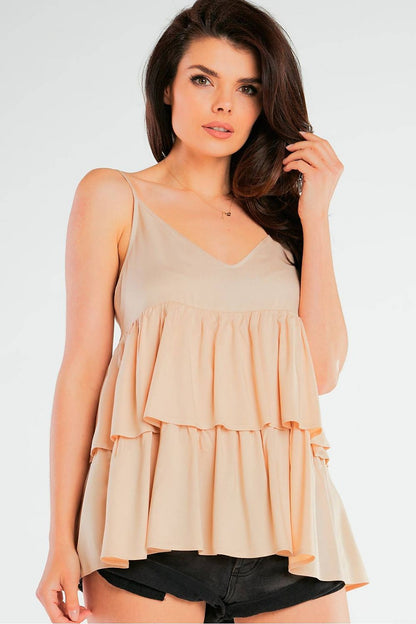 Elegant Loose-Fitting Viscose Blouse With Thin Straps And Frill Detailing by Awama, modeled in a nude shade, highlighting the delicate frills and sophisticated style.