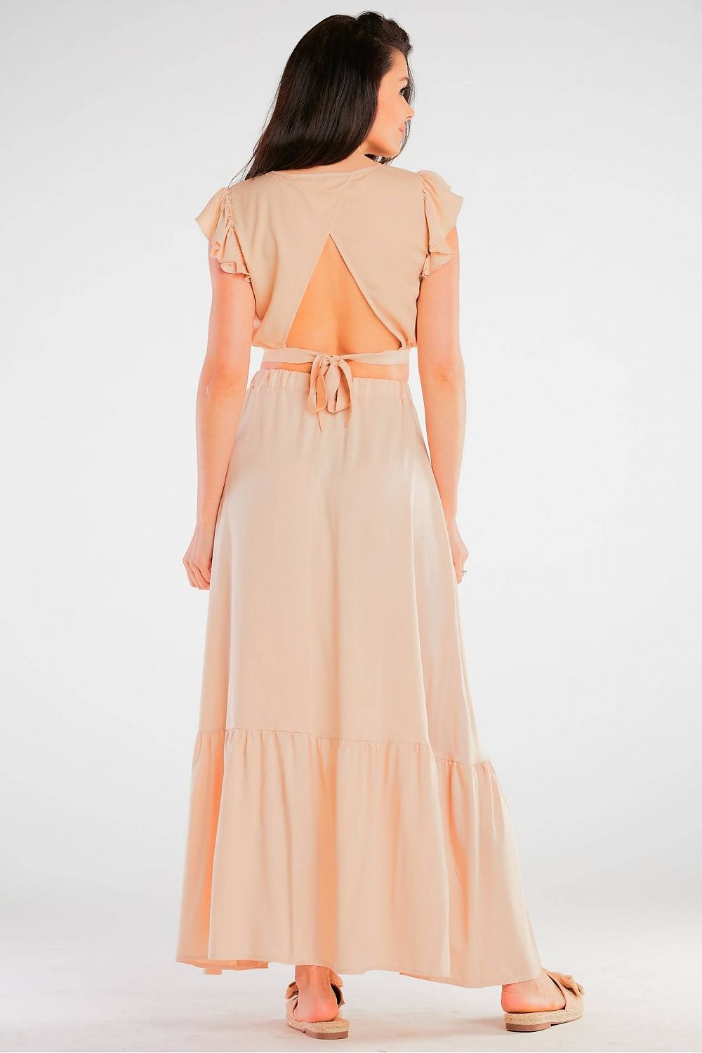 Elegant Maxi Skirt with Frill Detail, highlighting a model wearing a backless design of a peach maxi skirt, exemplifying comfort and elegance in a viscose blend for summertime.