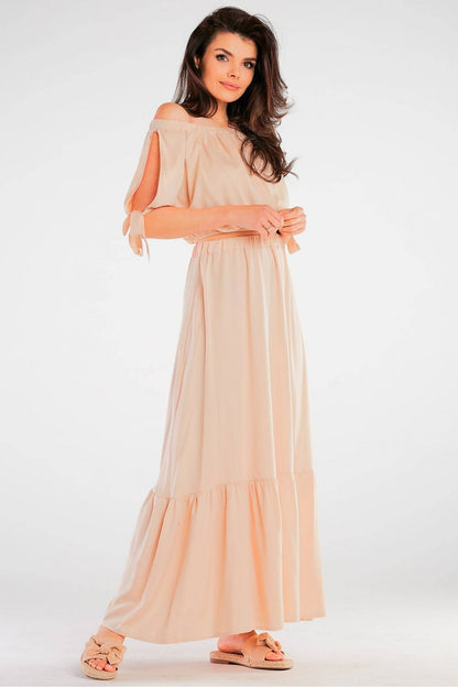 Elegant Spanish Style Blouse with Tied Sleeves - Light Viscose for Summer Comfort, highlighting a graceful model in a peach maxi blouse with tied sleeves and a gathered waist, ideal for summer elegance.
