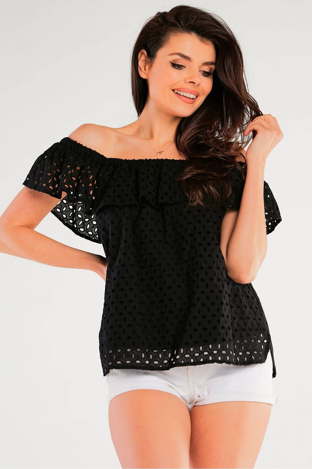 Airy Spanish-Style Blouse by Awama elegantly styled on a model, showcasing a loose-fitting black cotton design with a delicate frill neckline, perfect for summer.