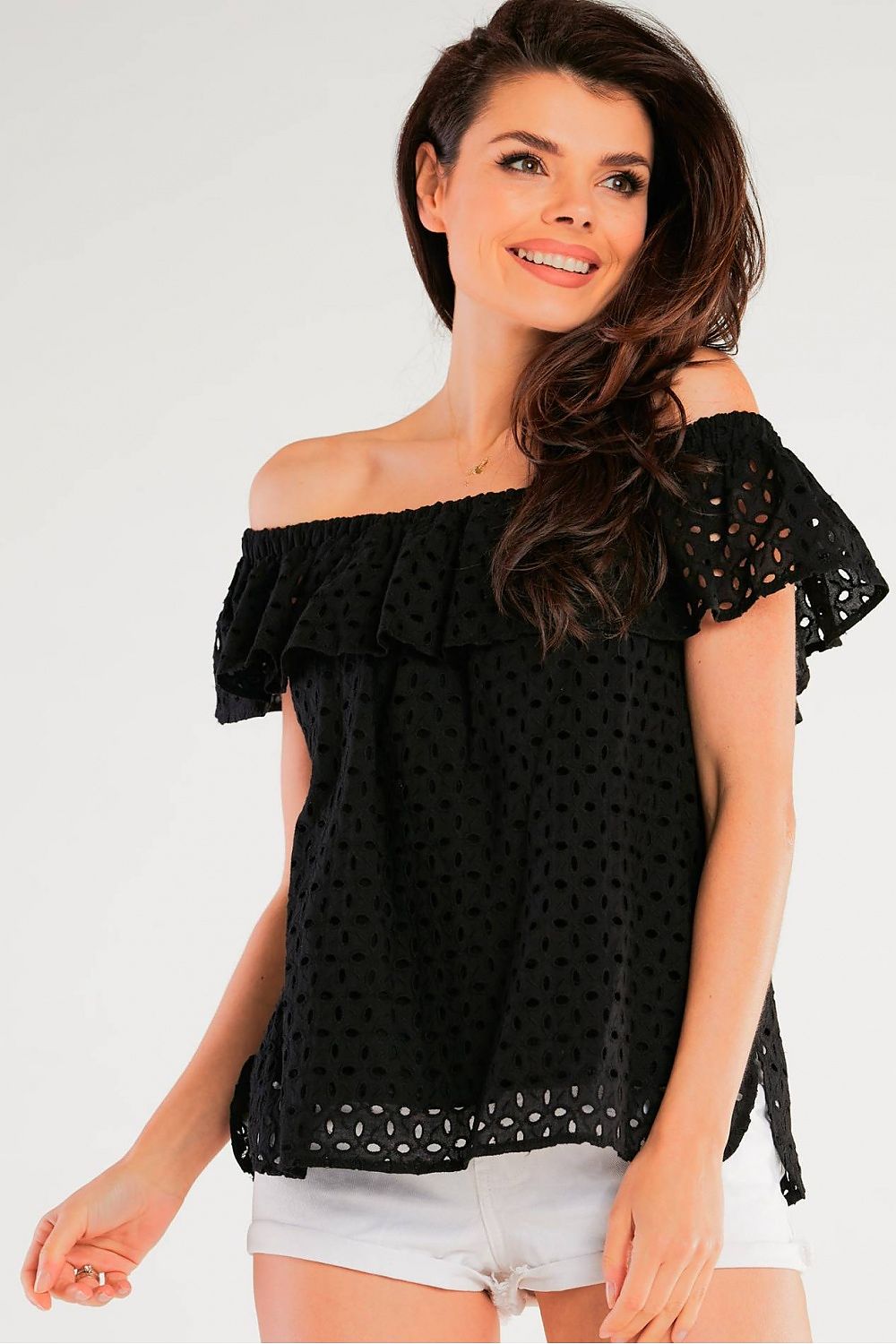 Close-up of a model wearing the Airy Spanish-Style Blouse by Awama, featuring a stylish off-shoulder frill neckline in soft black cotton, ideal for sunny outings.