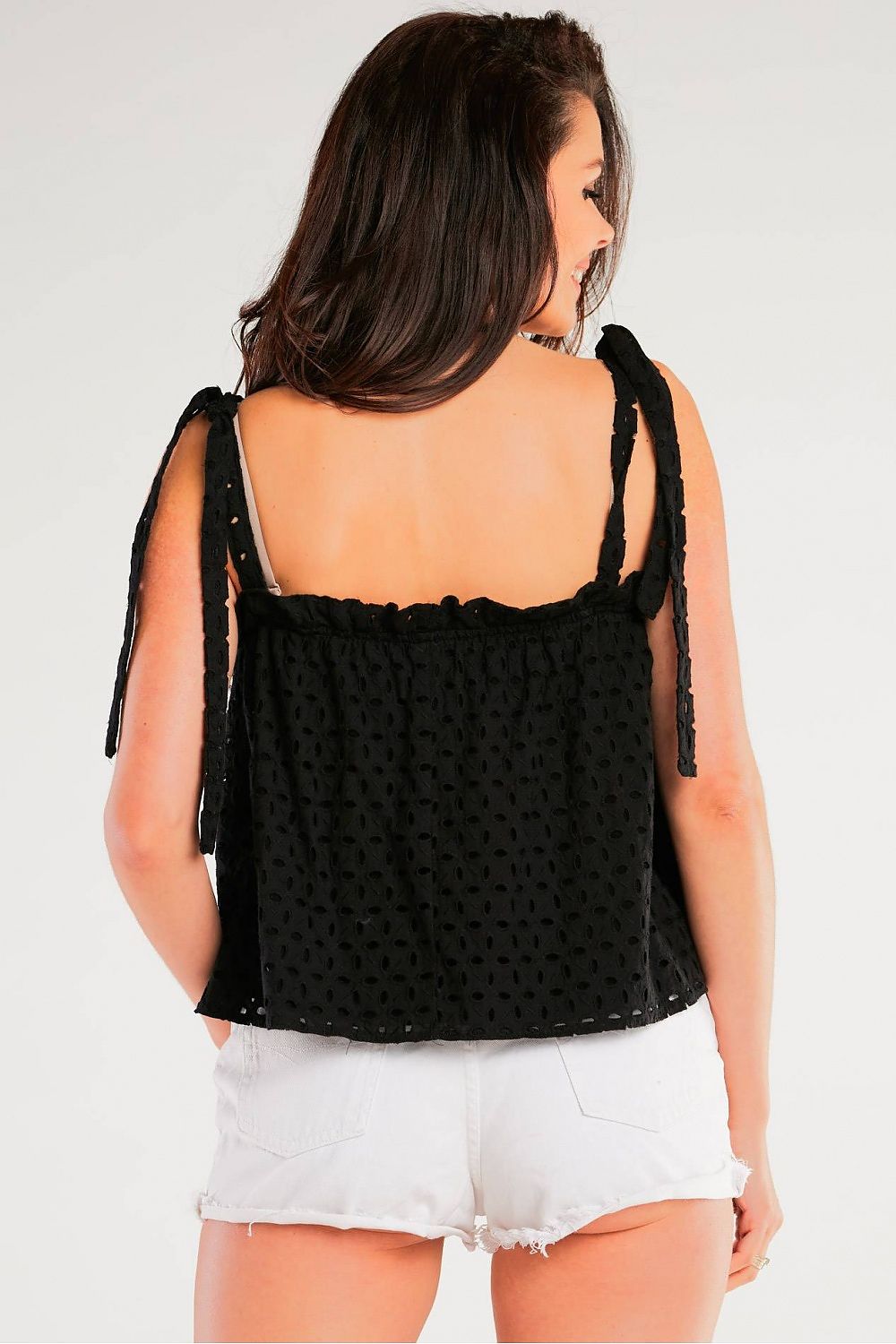 Stylish Loose Cotton Blouse With Tied Straps by Awama, displaying a rear view on a model to illustrate the charming tied straps and elegant silhouette.