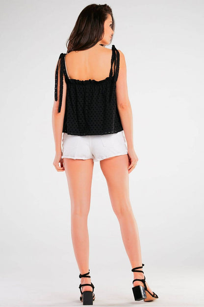 Stylish Loose Cotton Blouse With Tied Straps by Awama, featuring a rear view of the model in black, showcasing the intricate design for summer wear.
