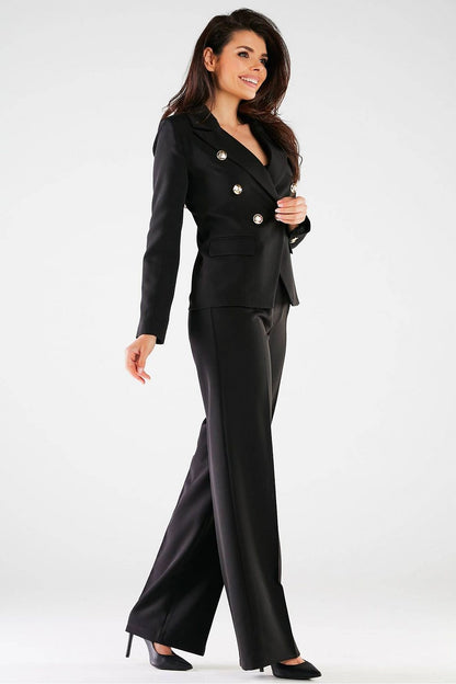 Elegant High Rise Wide Leg Trousers for Women by Awama in a stylish ensemble. The model exhibits a confident smile, elegantly paired with a tailored jacket, perfect for upscale occasions.