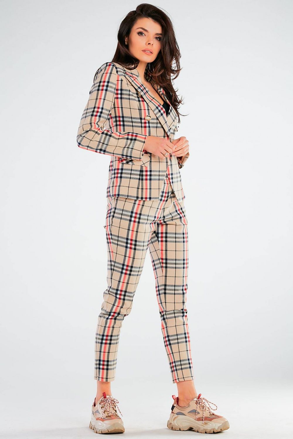Elegant Women's Fitted Trousers with Pockets in Unique Patterns by Awama, modelled in a striking pose showcasing the elegant silhouette of a beige plaid suit perfect for any upscale occasion.