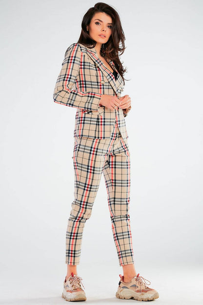 Elegant Women's Fitted Trousers with Pockets in Unique Patterns by Awama, modelled in a striking pose showcasing the elegant silhouette of a beige plaid suit perfect for any upscale occasion.