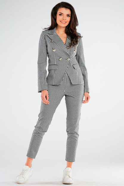 Elegant Women's Fitted Trousers with Pockets in Unique Patterns by Awama, presented in a fashionable black and white checkered suit, embodying luxury and style for modern women.