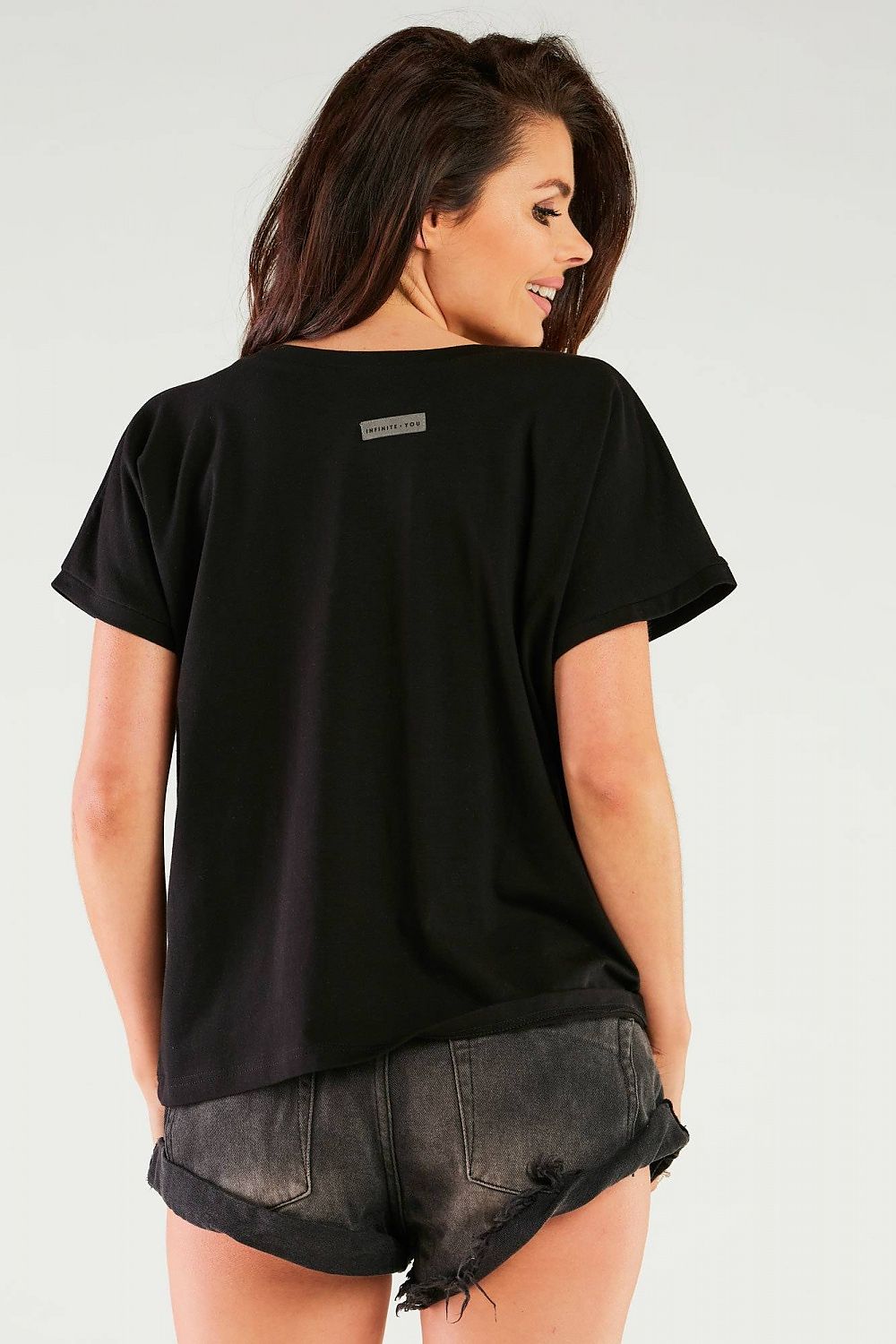 Stylish back view of the black cotton blouse with V-neckline, highlighting its elegant design and branding, from the Sensational Cotton Blouse collection by Infinite You, made in Poland.