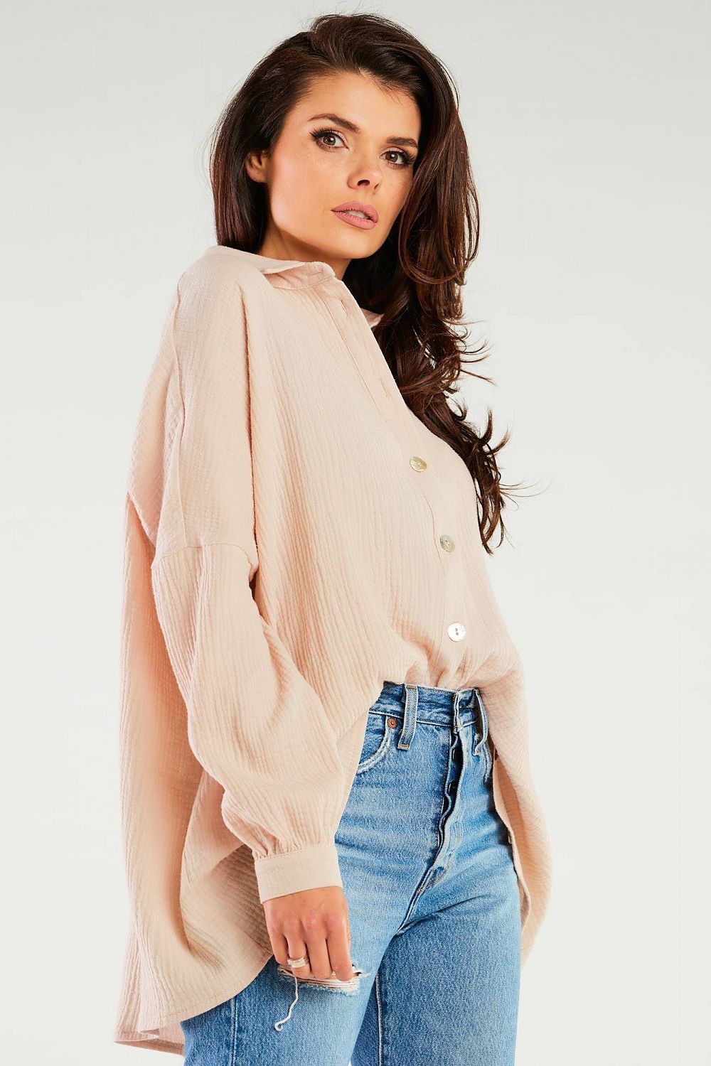Elegant Oversized Long Sleeve Shirt with Adjustable Neckline by Infinite You, showcasing the model in a flattering pose highlighting the shirt's loose fit and button detail, ideal for effortless elegance.
