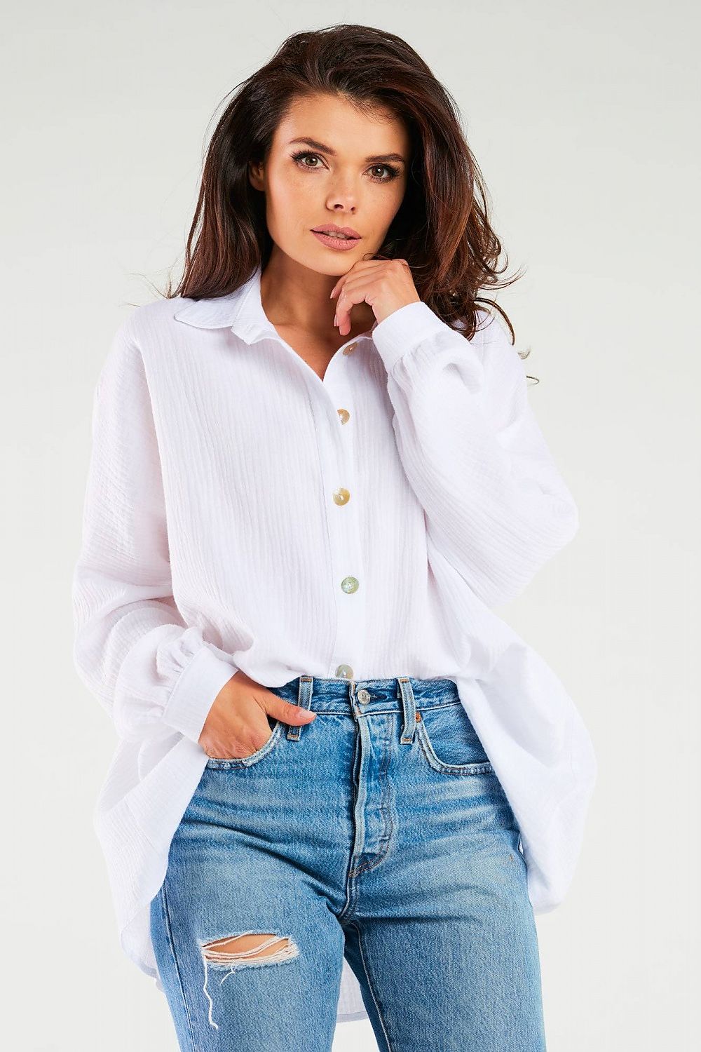 Elegant Oversized Long Sleeve Shirt with Adjustable Neckline by Infinite You, model presenting a white version of the shirt, styled with high-waisted jeans for a chic look.