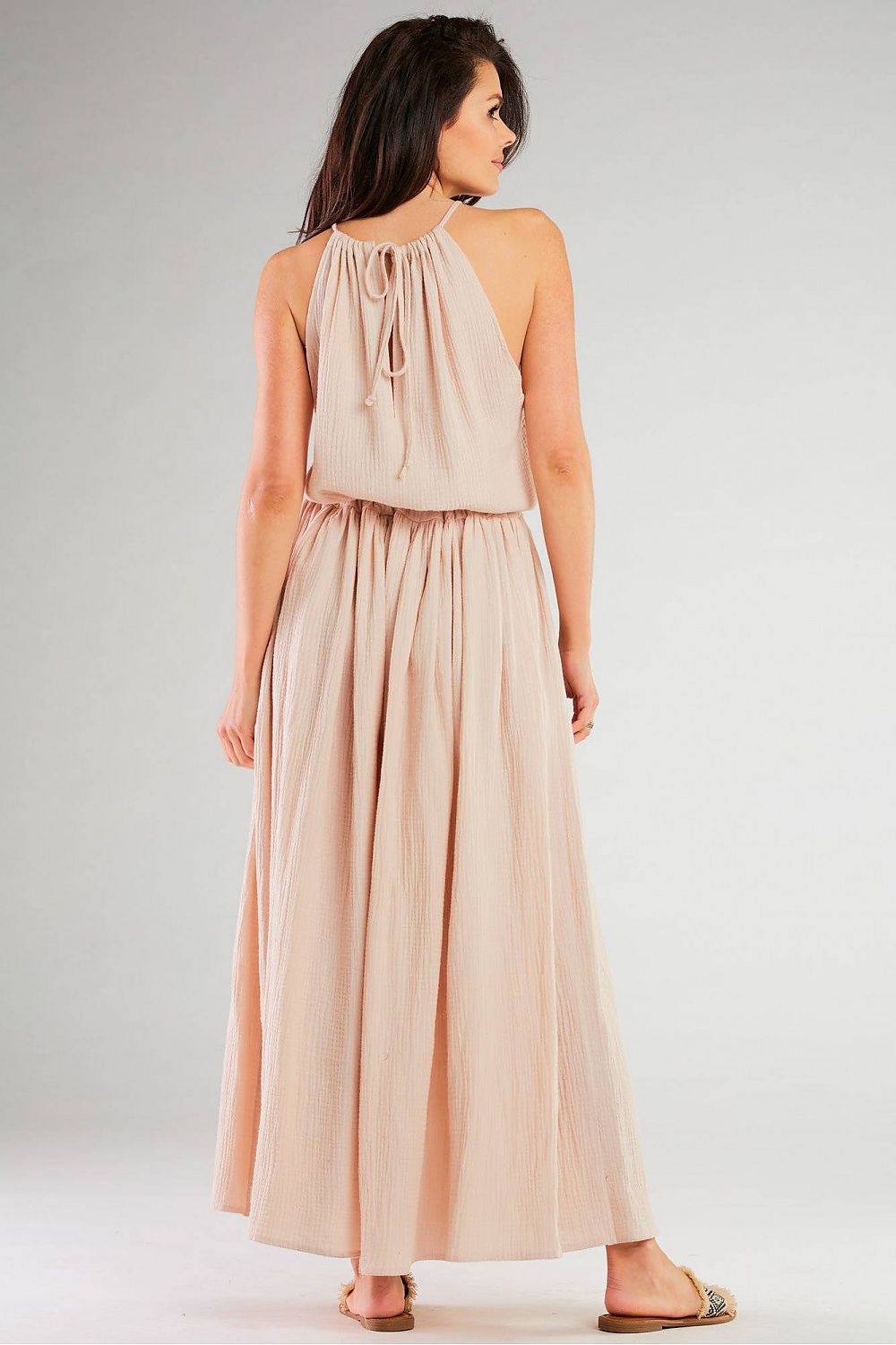 Back view of the Infinite You Daydress With Side Slits in subtle blush, highlighting its luxurious fabric and flattering drawstring detail.