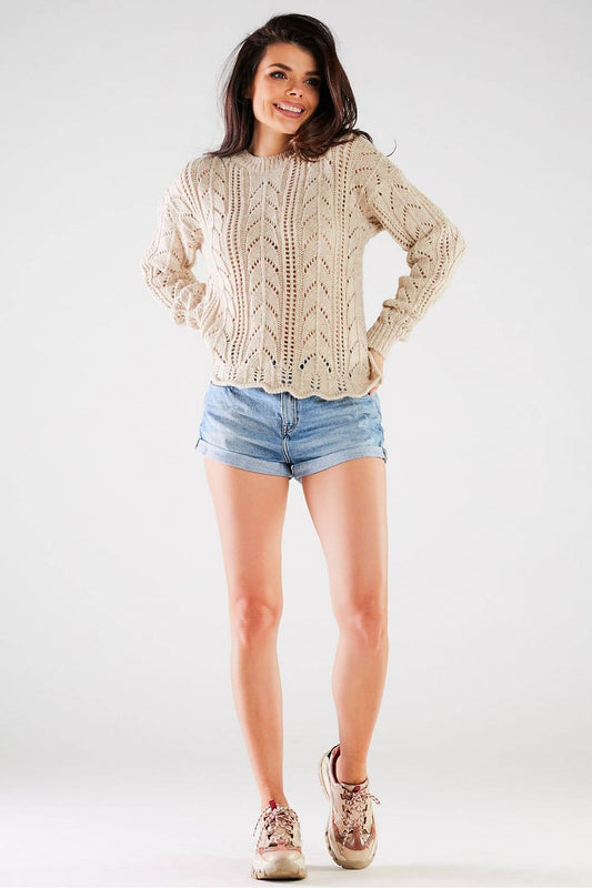 Luxury Ladies Sweater by Awama in a neutral tone, featuring a long sleeve design with a stylish ribbed finish, showcased on a model wearing denim shorts and sneakers.