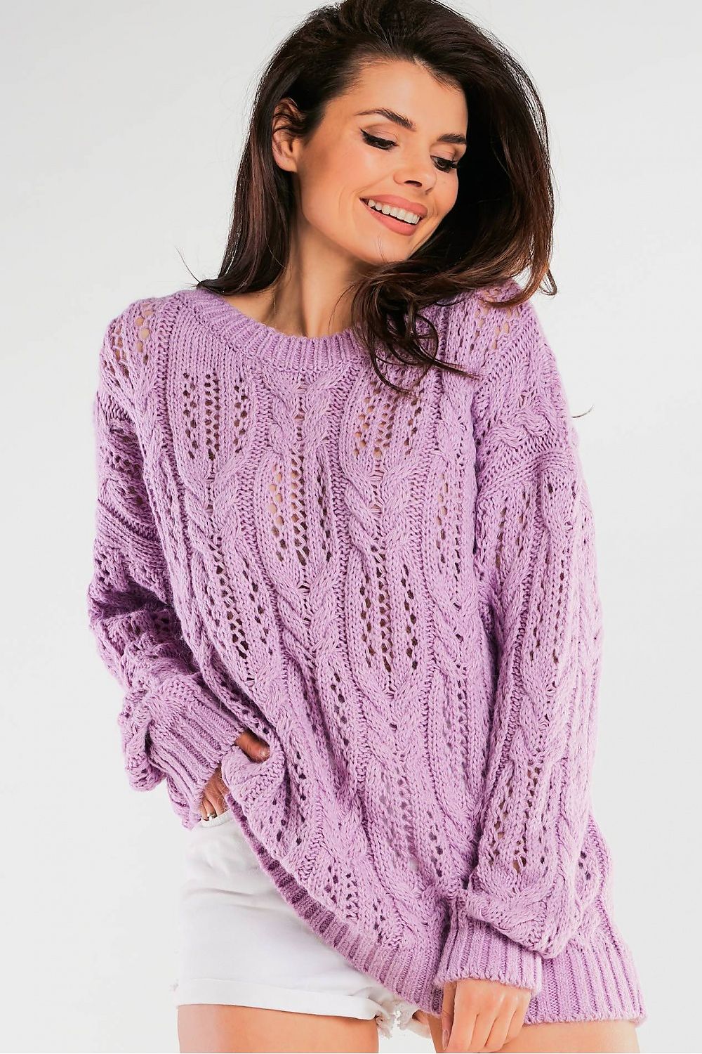 Openwork Sweater by Awama with Boat Neckline and Long Sleeves - Elegant Knit Design in a luxurious lilac colour, worn by a model smiling gracefully, showcasing its intricate knitting.