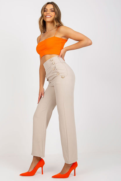 Luxury Women's High-Waisted Trousers with Decorative Buttons showcased on a model wearing an orange crop top and vibrant heels, highlighting elegance and sophistication.
