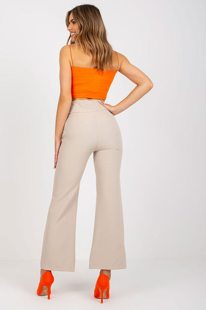 Back view of a model wearing Luxury Women's High-Waisted Trousers with Decorative Buttons, accentuating the smooth silhouette and high fashion styling.