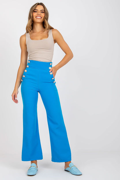 Model featuring Luxury Women's High-Waisted Trousers with Decorative Buttons in striking blue, paired with a neutral top, embodying chic contemporary style.