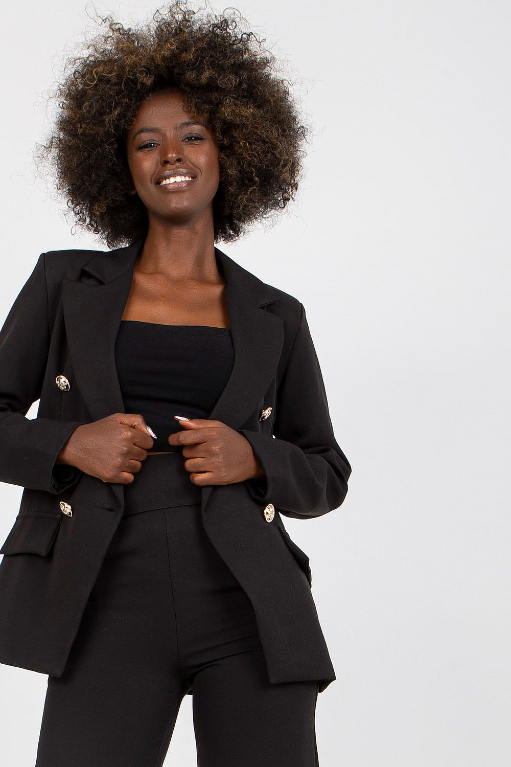 Stylish Ladies' Jacket by Italy Moda featuring shoulder cushions and imitation pockets, elegantly styled in black on a model with curly hair.
