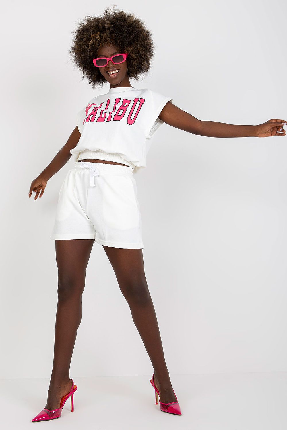 Ex Moda Cotton Blend Tracksuit Set featuring a stylish blouse and high-waist shorts, model posing confidently, showcasing a chic and comfortable vibe.