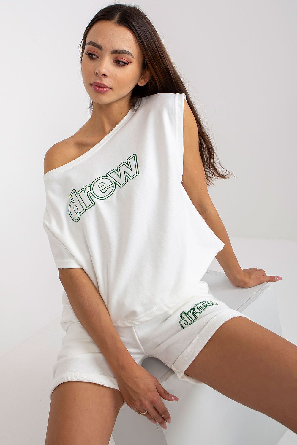 Luxury Ex Moda Women's Tracksuit Set featuring a relaxed cotton blouse and high-waisted shorts, elegantly styled with an off-shoulder design.