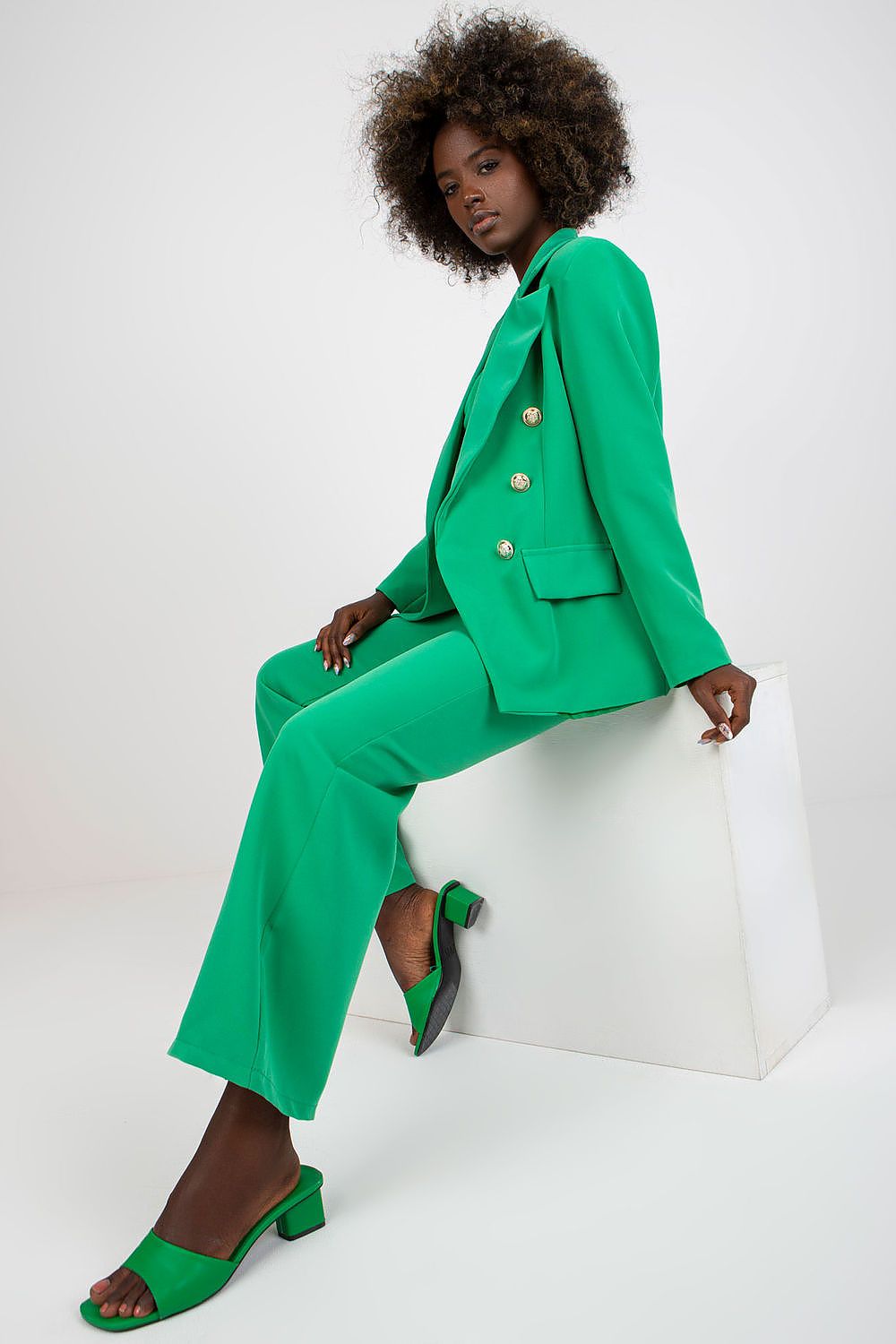 Stylish Ladies' Jacket by Italy Moda showcased in green, elegantly posed on a model, radiating sophistication and modern chic aesthetics.