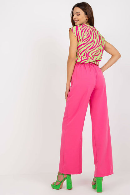 Back view showcasing the Luxury Women’s Italy Moda Trousers - High Rise Fabric Pants with Zip and Button Fastening, paired with a striking pink top, reflecting fashionable luxury.