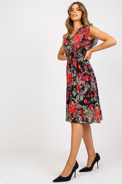 Pleated Summer Dress With Frill Sleeves, Heart Neckline & Flared Cut by Italy Moda - Model displaying a floral dress with frill sleeves, showcasing its stylish design and luxurious fabric.