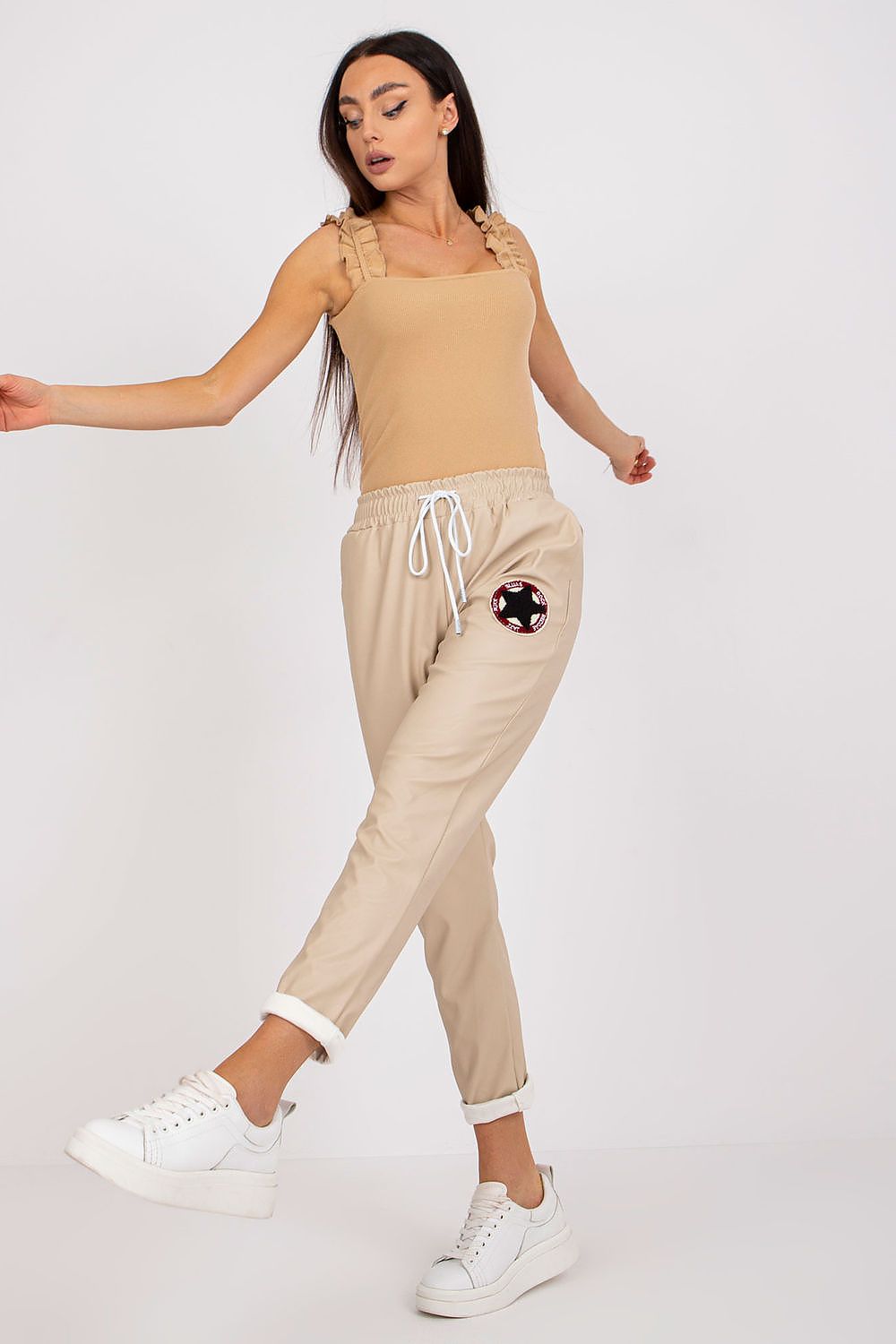 Luxury Women's Ecological Leather Trousers With Elastic Waistband - Italy Moda, captured in action as a model showcases the elegant fit and trendy style, perfect for fashionable women.