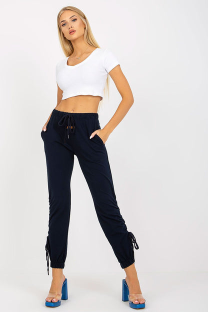 Luxury High Rise Sweatpants With Tie Waist And Slip-On Pockets - Cotton Blend Comfortable Trousers, model exuding elegance in navy sweatpants paired with a crisp white crop top.