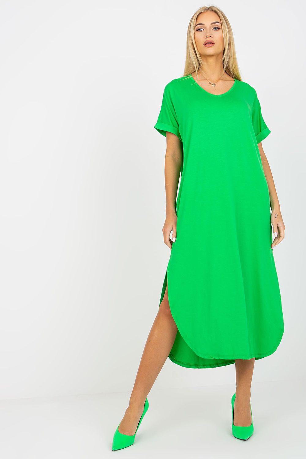 Elegant luxury short-sleeved daydress by Och Bella in vibrant green, showcasing stylish slits and practical side pockets, perfect for a chic day out.