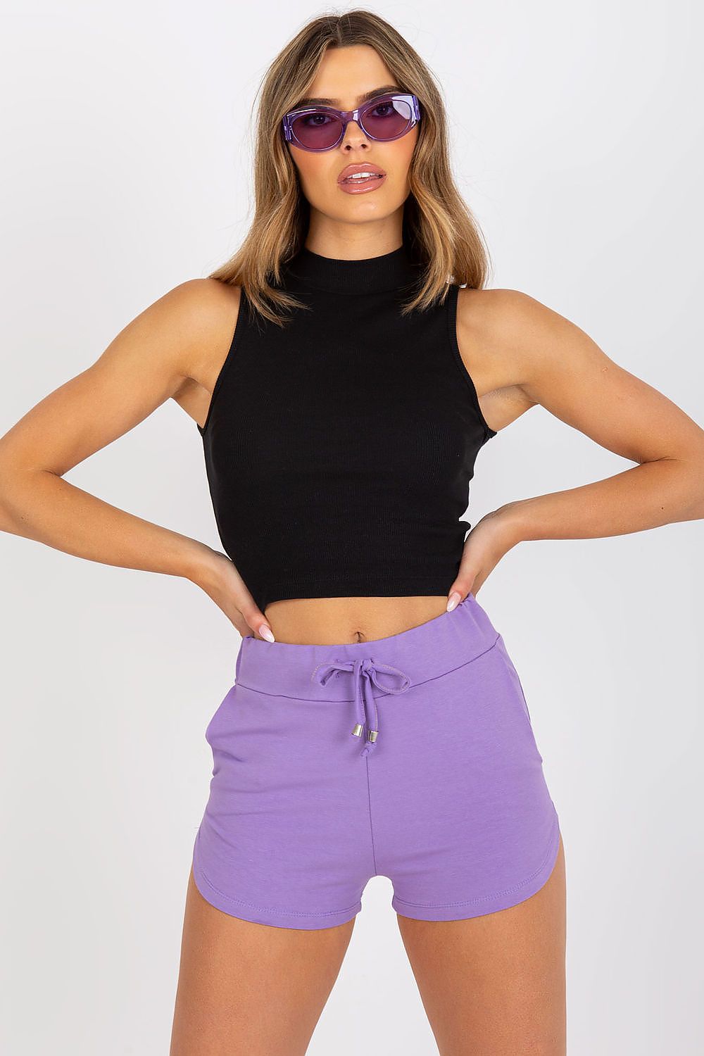 Elegant Ribbed Fabric Half-Zip Top by BFG in classic black, featuring a chic design complemented by vibrant purple shorts, embodying luxury casual fashion in EU sizes S-L.