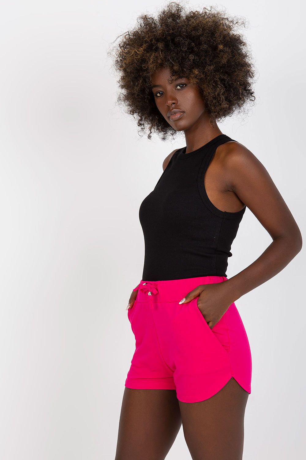 Elevate your summer wardrobe with High-Waisted Cotton Spandex Sweatshorts with Drawstring and Slip-On Pockets by BFG, showcased in vibrant pink on a model against a minimalist backdrop.