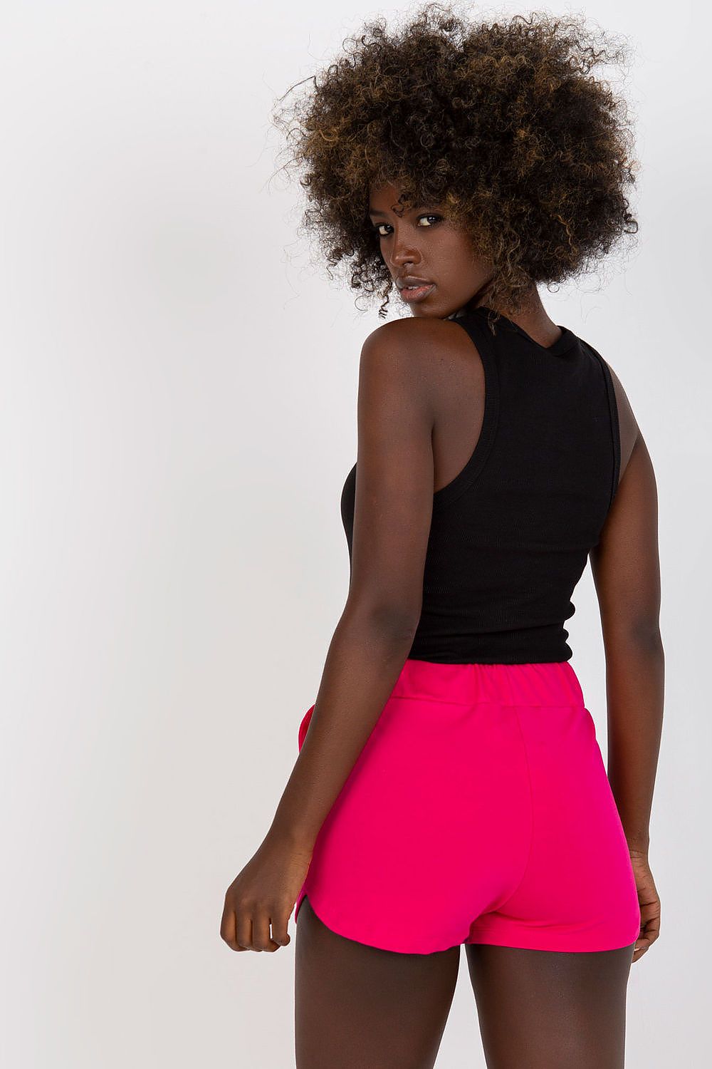 Discover the perfect blend of comfort and style with High-Waisted Cotton Spandex Sweatshorts with Drawstring and Slip-On Pockets by BFG, featured in bold pink on a model, emphasising the shorts' chic design.