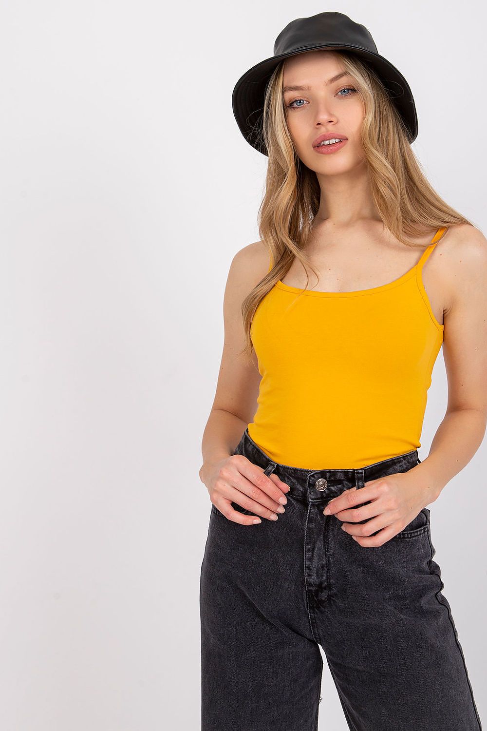 Luxurious Cotton Spandex Strapless Shirt with Round Neckline - Model showcases the vibrant yellow strapless shirt paired with stylish black high-waisted jeans, perfect for versatile styles.