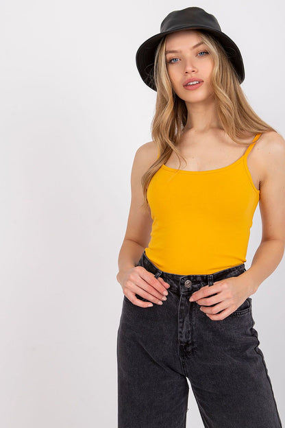 Luxurious Cotton Spandex Strapless Shirt with Round Neckline - Model showcases the vibrant yellow strapless shirt paired with stylish black high-waisted jeans, perfect for versatile styles.
