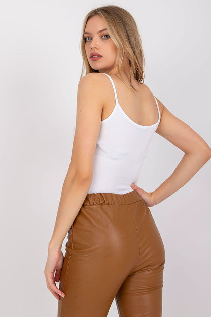 Back view of a model wearing a luxurious cotton spandex strapless shirt with round neckline, displaying a smooth fit and chic brown leather pants - perfect for versatile styles.