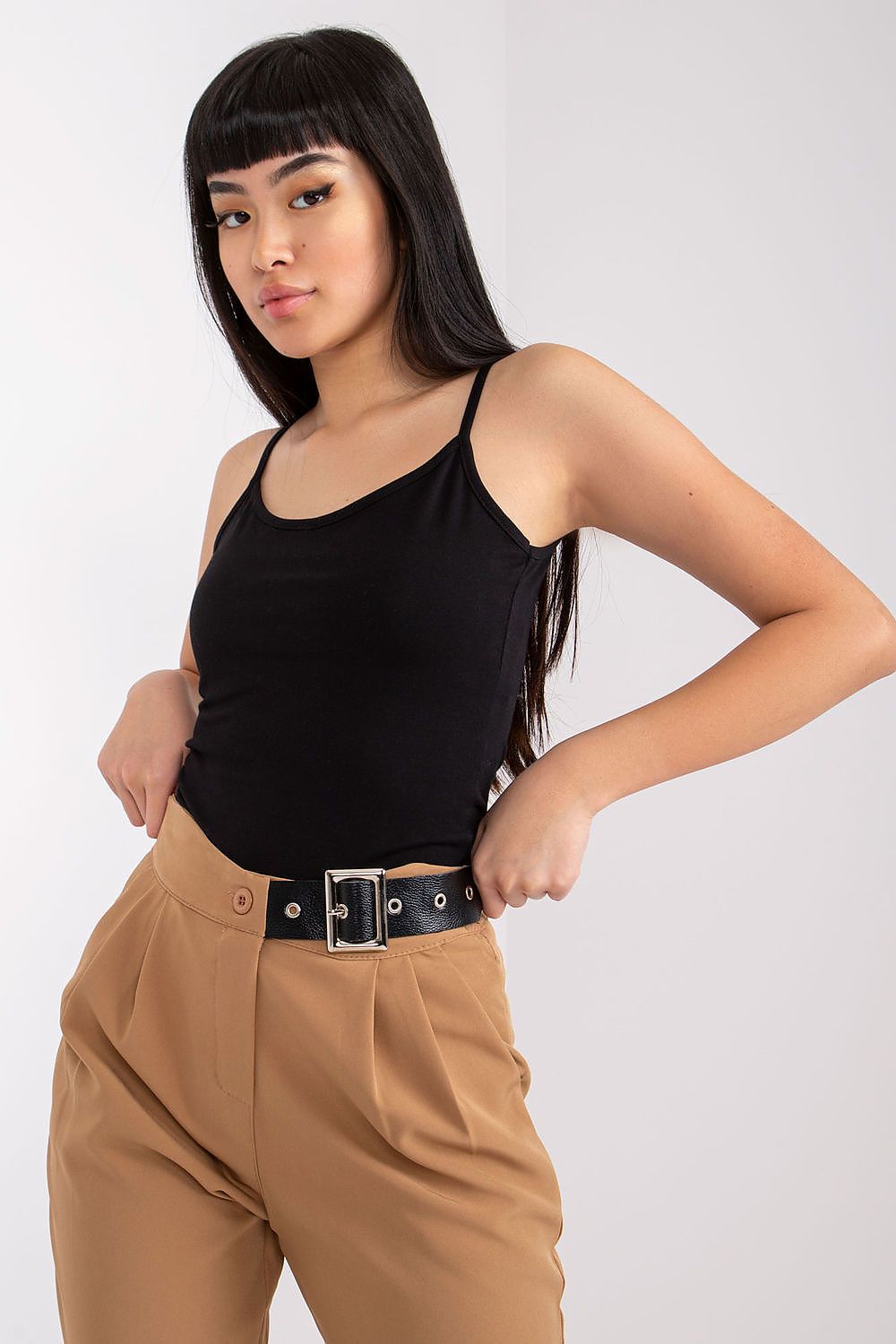 Luxurious Cotton Spandex Strapless Shirt with Round Neckline displayed by a model in a stylish black top, highlighting its versatile nature for various fashion looks.