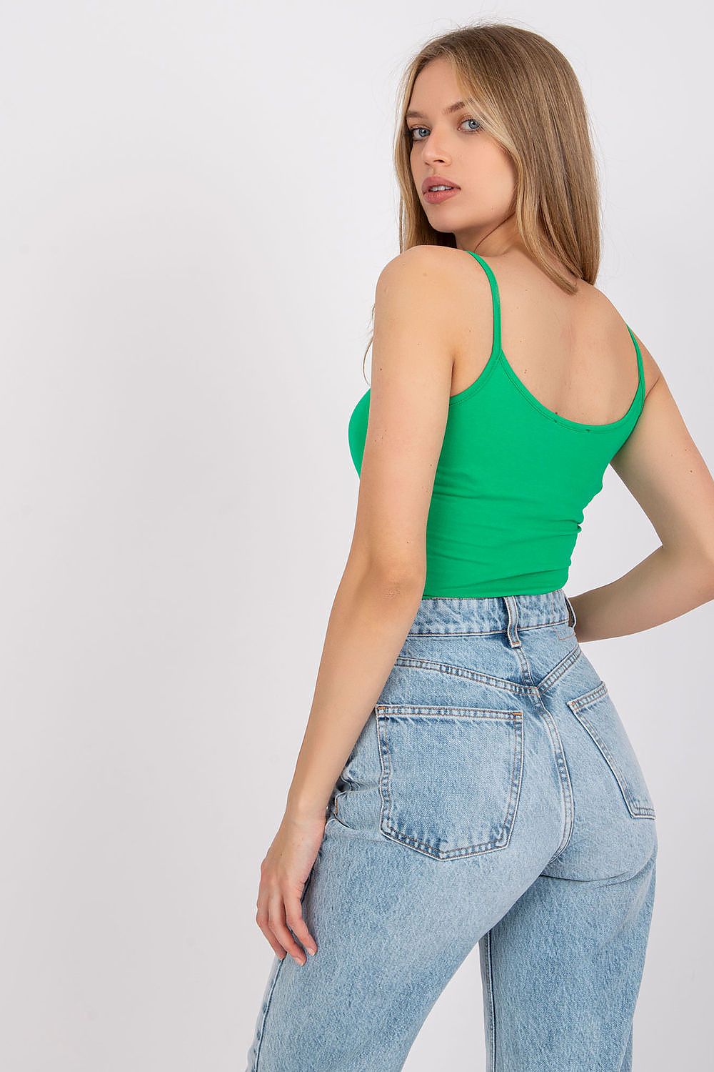 Luxurious Cotton Spandex Strapless Shirt with Round Neckline showcased in vibrant green, paired elegantly with high-waisted denim, offering a perfect look for versatile styles.
