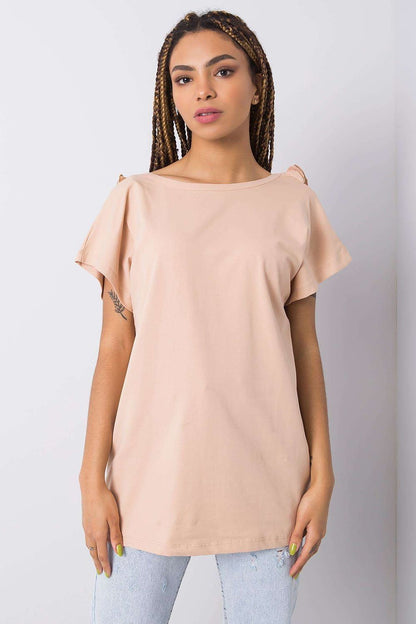Elegant short sleeve blouse with frill trimmed deep cut-out in delicate peach colour, made from cotton-lycra blend, model showcasing relaxed fit, EU Size 0.
