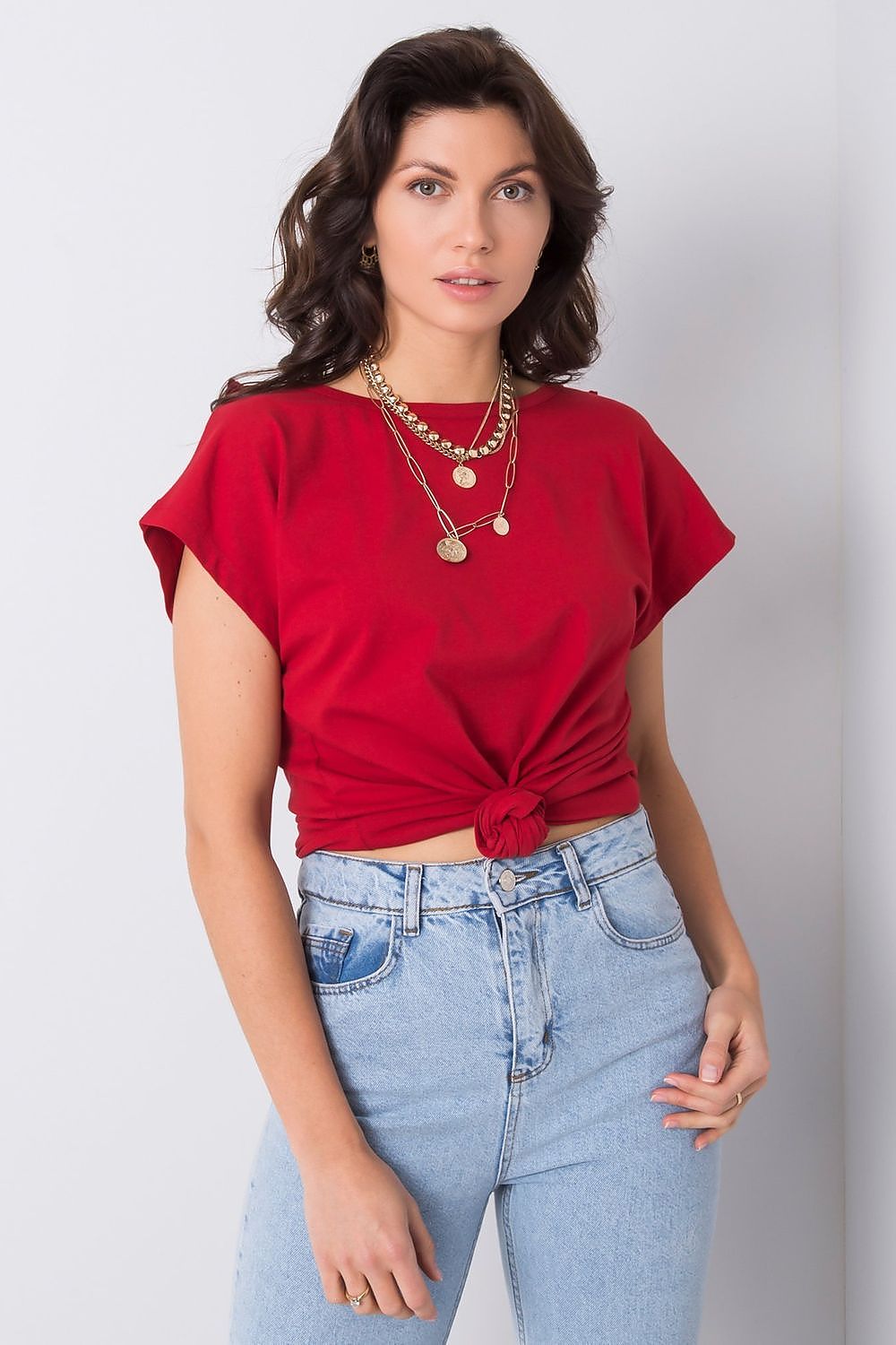 Elegant Short Sleeve Blouse With Frill Trimmed Deep Cut-Out, Cotton-Lycra Blend, EU Size 0, featured in a luxurious red hue, styled with layered gold necklaces and paired with high-waisted denim jeans.
