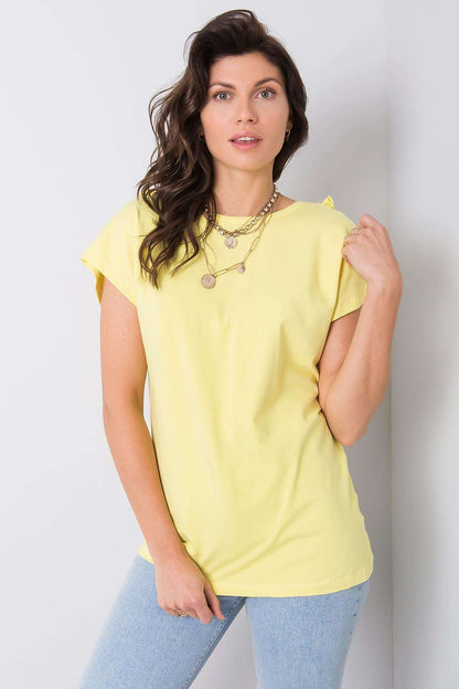 Elegant Short Sleeve Blouse With Frill Trimmed Deep Cut-Out in yellow cotton-lycra blend, showcased by a woman wearing layered necklaces with a natural pose.