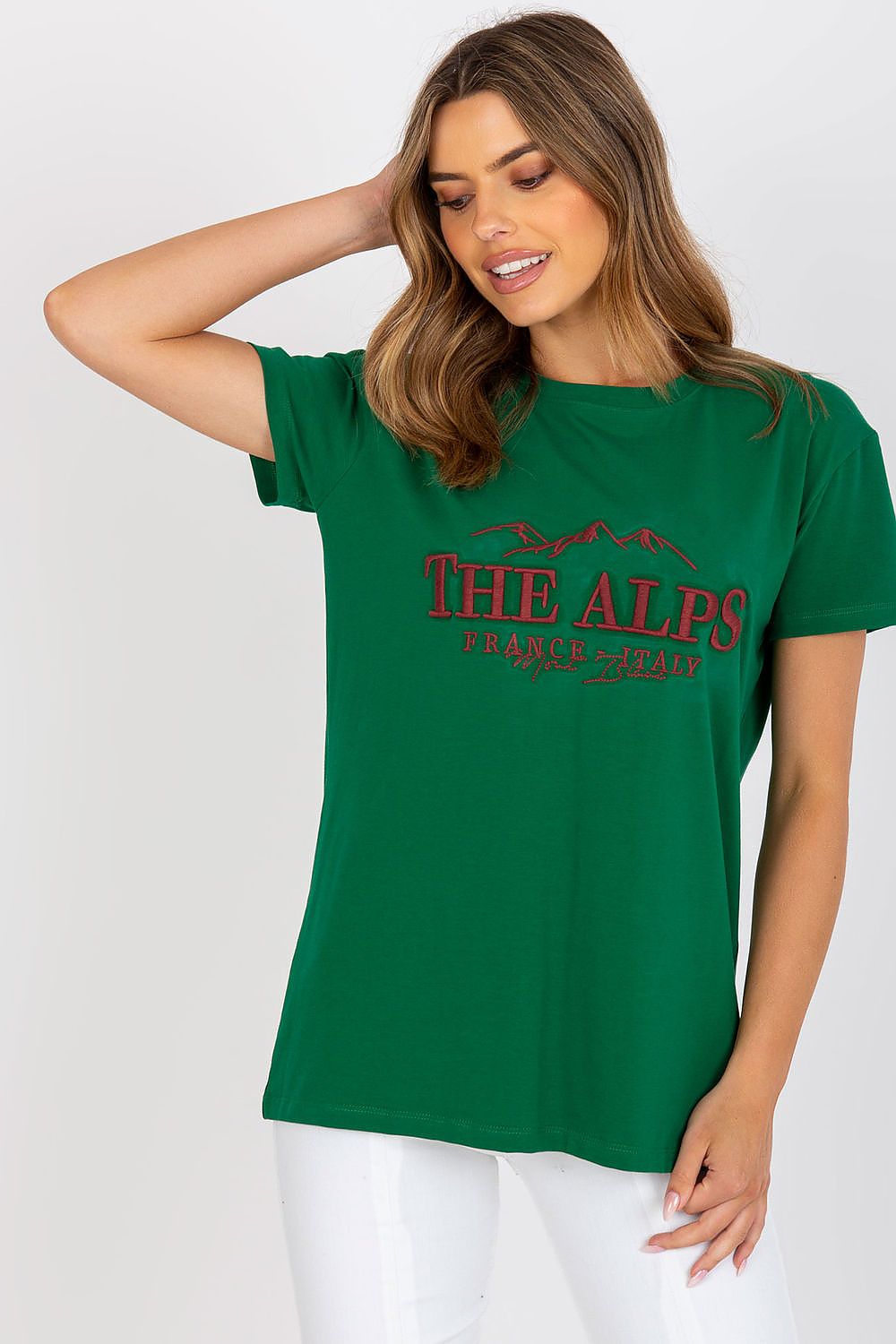 Stylish Cotton Blend T-Shirt with Embroidered Design - EU Size 0, highlighting a close-up of a model in a green t-shirt with 'THE ALPS' embroidered design, symbolising luxury and comfort.