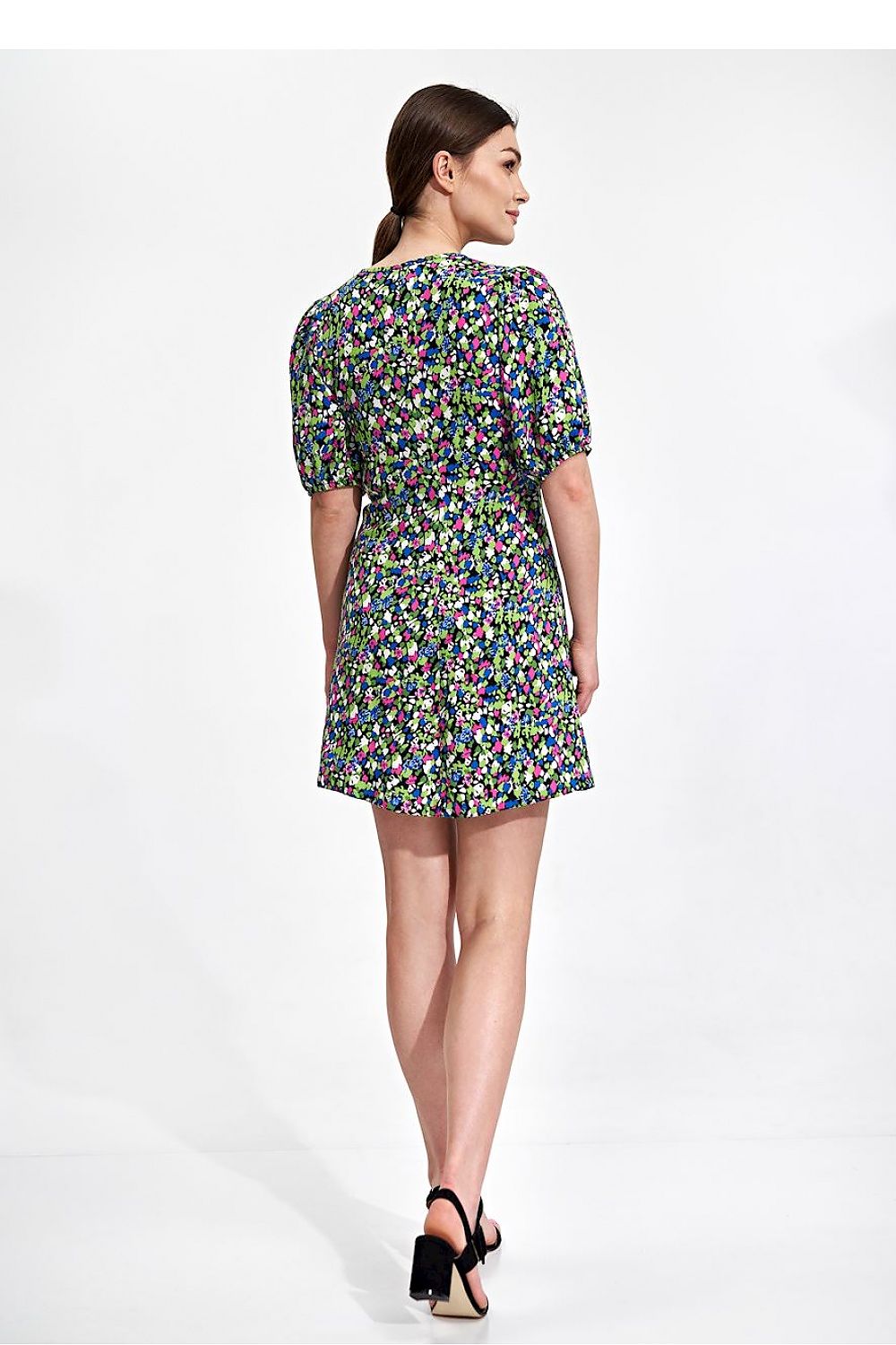 Back view of the elegant summer mini dress by Figl featuring vibrant floral patterns, loose sleeves, and a relaxed silhouette.