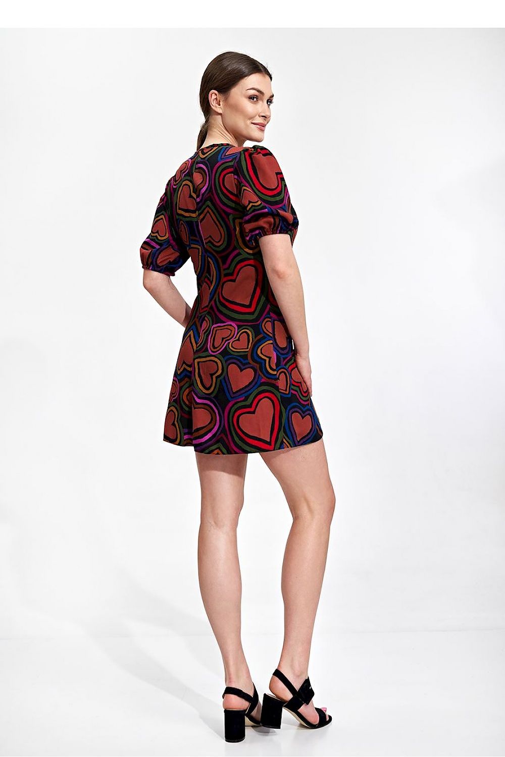 Elegant Summer Mini Dress by Figl featuring a vibrant heart pattern, loose sleeves, and a flared bottom, elegantly showcased on a model from the back.