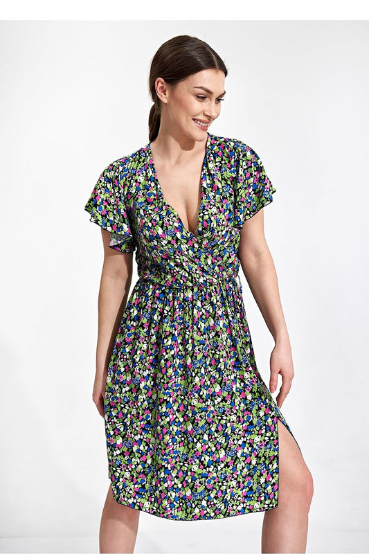 Summer Midi Dress by Figl featuring an envelope neckline, ethereal sleeves, and decorative slit. The model showcases a vibrant floral print dress against a subtle backdrop, epitomizing elegance.