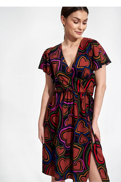 Stylish Summer Midi Dress by Figl with vibrant heart patterns. It showcases an envelope neckline and ethereal sleeves, ideal for a fashionable summer look.