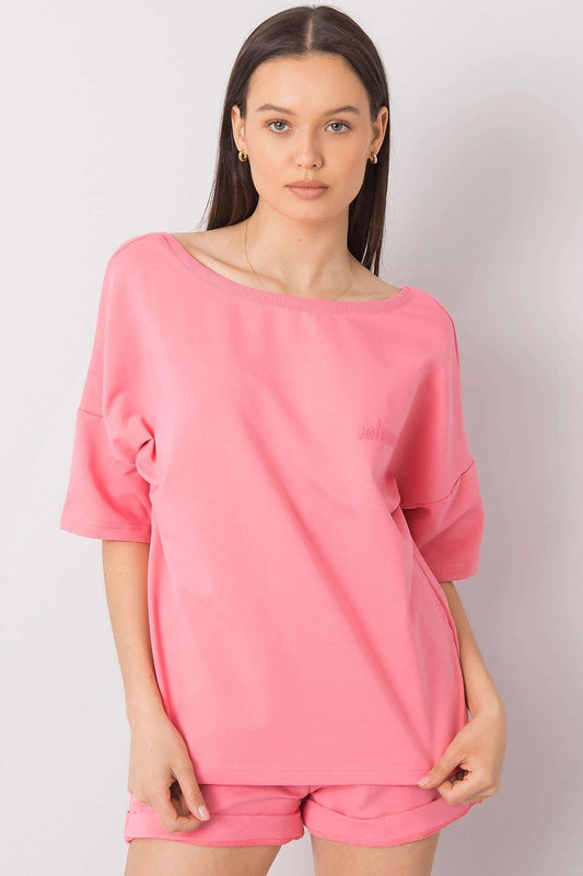 Elegant Cotton Blouse And Shorts Set With Elastic Waistband And Slip-On Pockets featuring a model in a chic pink outfit, showcasing the loose-fit blouse and comfortable shorts.