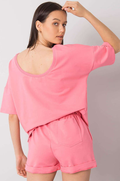 Elegant Cotton Blouse And Shorts Set With Elastic Waistband And Slip-On Pockets displayed by a model, featuring a fashionable back view of the pink ensemble.