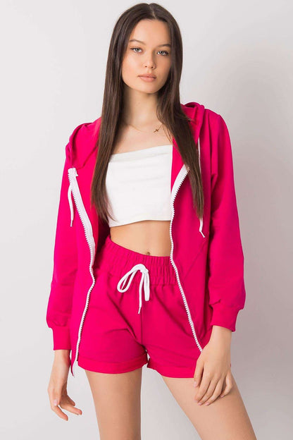 Luxury Tracksuit Set in vibrant pink, model showcasing a fashionable look in a zipper hoodie and elastic waist shorts, ideal for stylish comfort.